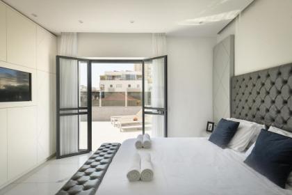 Bright & Modern 2BR Apt with Spacious Terrace 5-min from Beach by Sea N' Rent - image 19