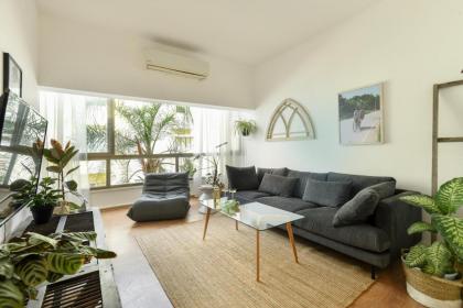 Cozy 2BR Apt w Green Oasis a 3 Min Walk from Beach by Sea N' Rent - image 12